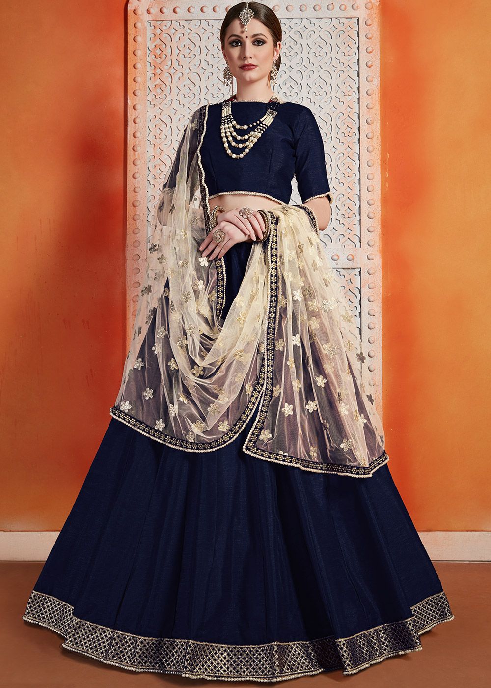 NAVY BLUE LEHENGA SET WITH MULTI COLOURED AND SILVER PATTERNED EMBROIDERY  PAIRED WITH A MATCHING DUPATTA AND SILVER TASSELS. - Seasons India