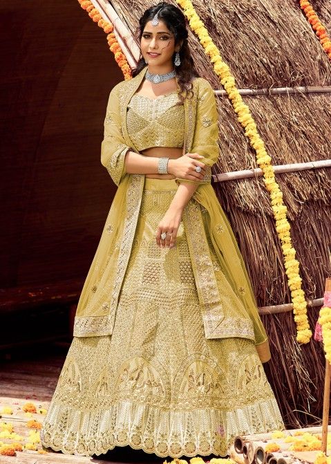 MUSTARD YELLOW THREAD WORK LEHENGA SET WITH COLOURED DETAILS AND A HAND  EMBROIDERED BLOUSE PAIRED WITH A MATCHING DUPATTA AND LIGHT GOLD SEQUIN  DETAILS. - Seasons India