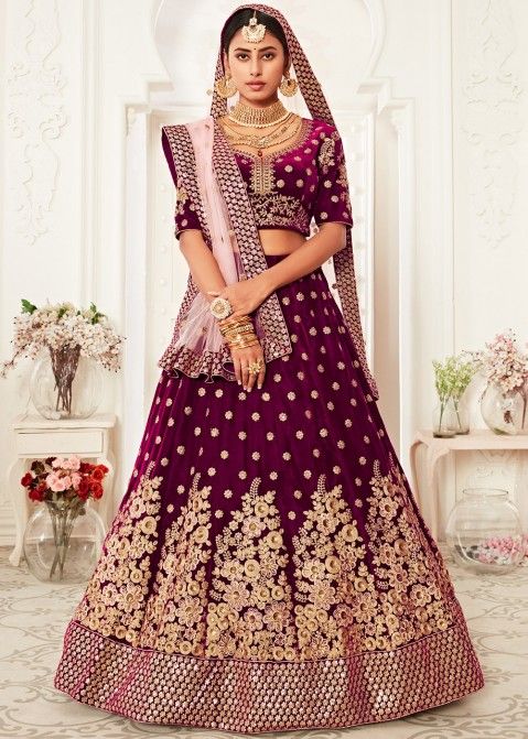 Wine colour sequined Lehenga with yellow sequined Blouse and tassled pale  Peach Dupatta with prints in a sequined and taped border. | Shayona