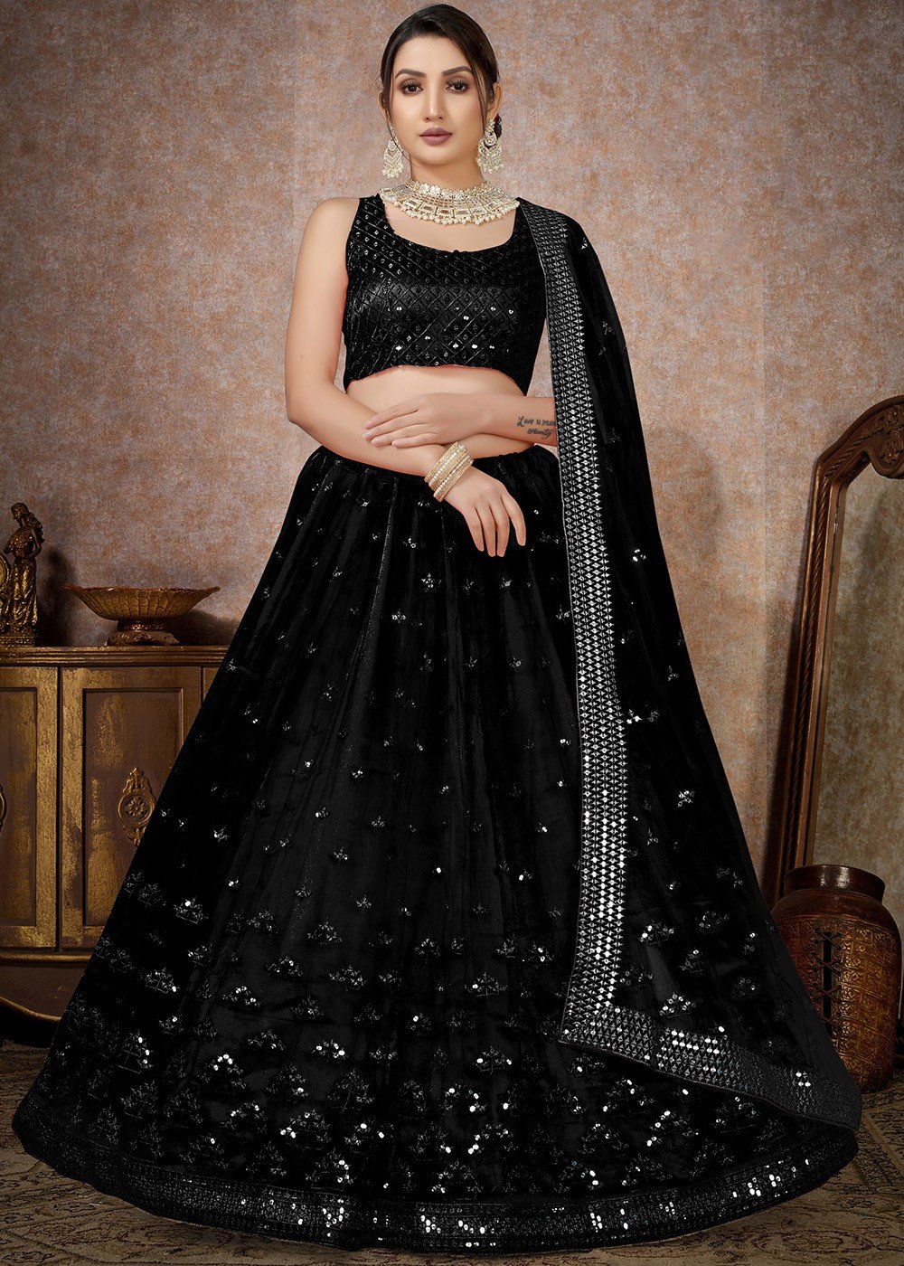Black floral embroidered strappy blouse and lehenga set available only at  Pernia's Pop Up Shop. 2024