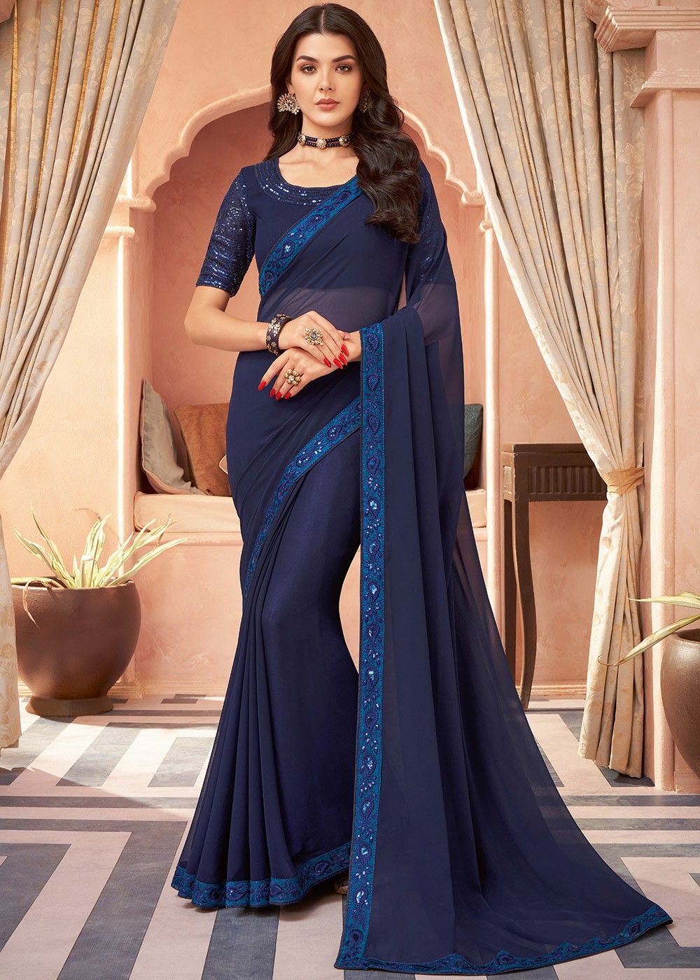 Buy this Navy blue saree & peach blouse with hand embroidery on sleeves