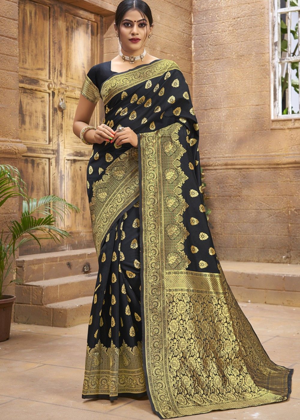 Black chiffon saree with butti and heavy embroidered border only on Kalki