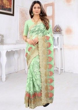 Heavy Border Embroidered Green Saree In Net