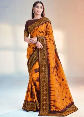 Orange Printed Saree With Embroidered Borders