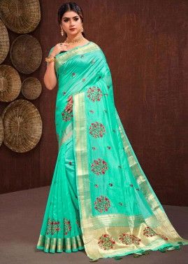 Turquoise Tissue Saree With Woven Border