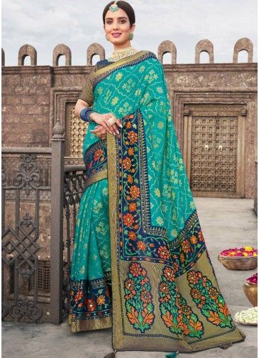 Turquoise Georgette Brasso Saree With Heavy Border