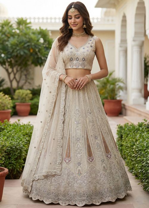 Off White Net Lehenga Choli With Intricate Embroidery