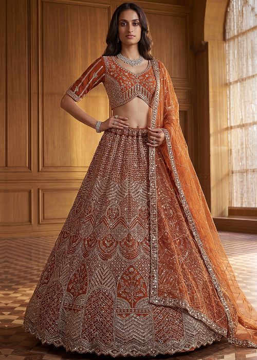 Rust Orange Net Lehenga Choli With Stone Embroidery