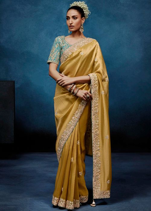 Golden Tissue Saree With Blue Embroidered Blouse