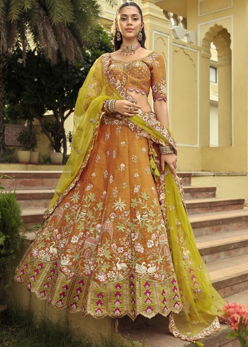 Orange Silk Lehenga Choli With Green Net Dupatta